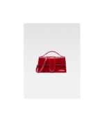 Discover The Large Bambino Dark Red, a stunning piece from Jacquemus. Elevate your style with this luxurious bag, perfect for any occasion. Shop now for exclusive deals!